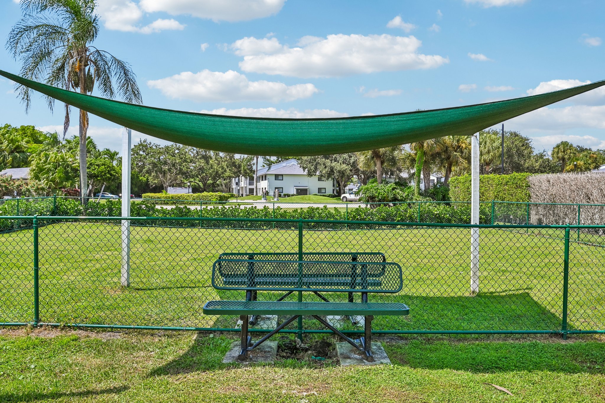fenced dog park with shaded cover Azalea Village 