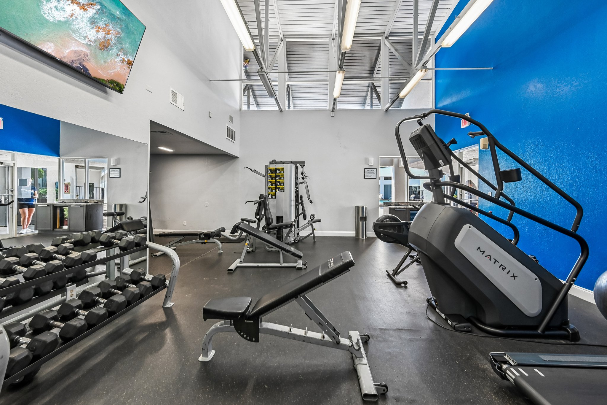 fitness center with blue wall and weights Azalea Village 
