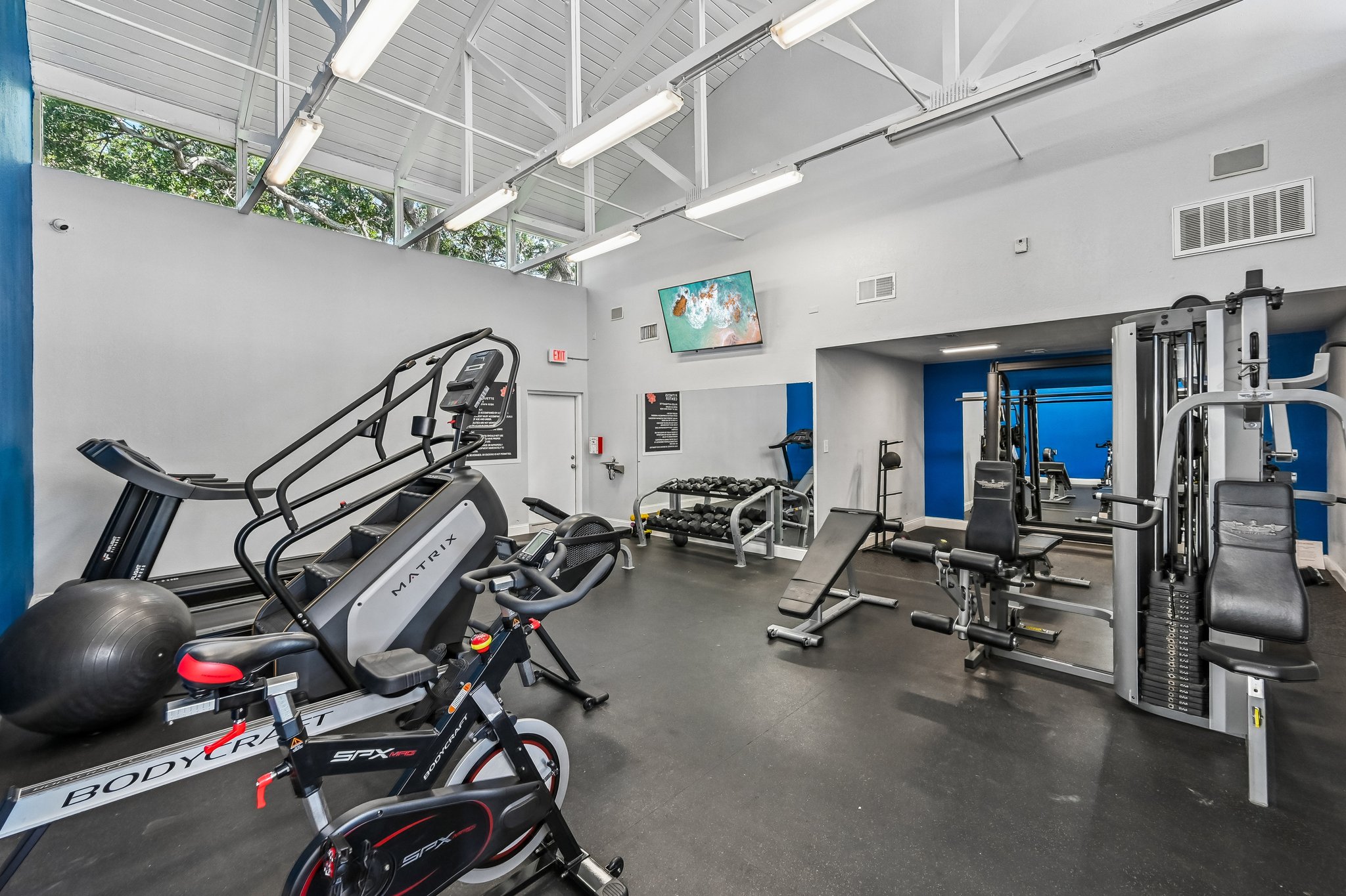 fitness center with blue wall and weights Azalea Village 