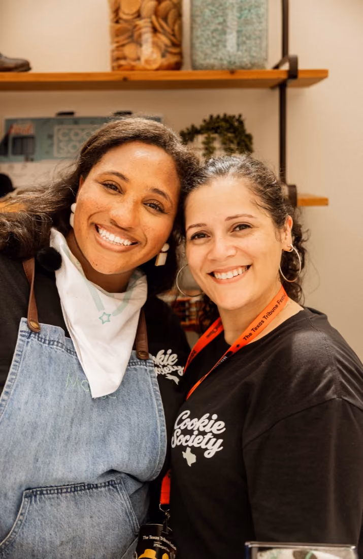 Two smiling Cookie Society team members in the shop