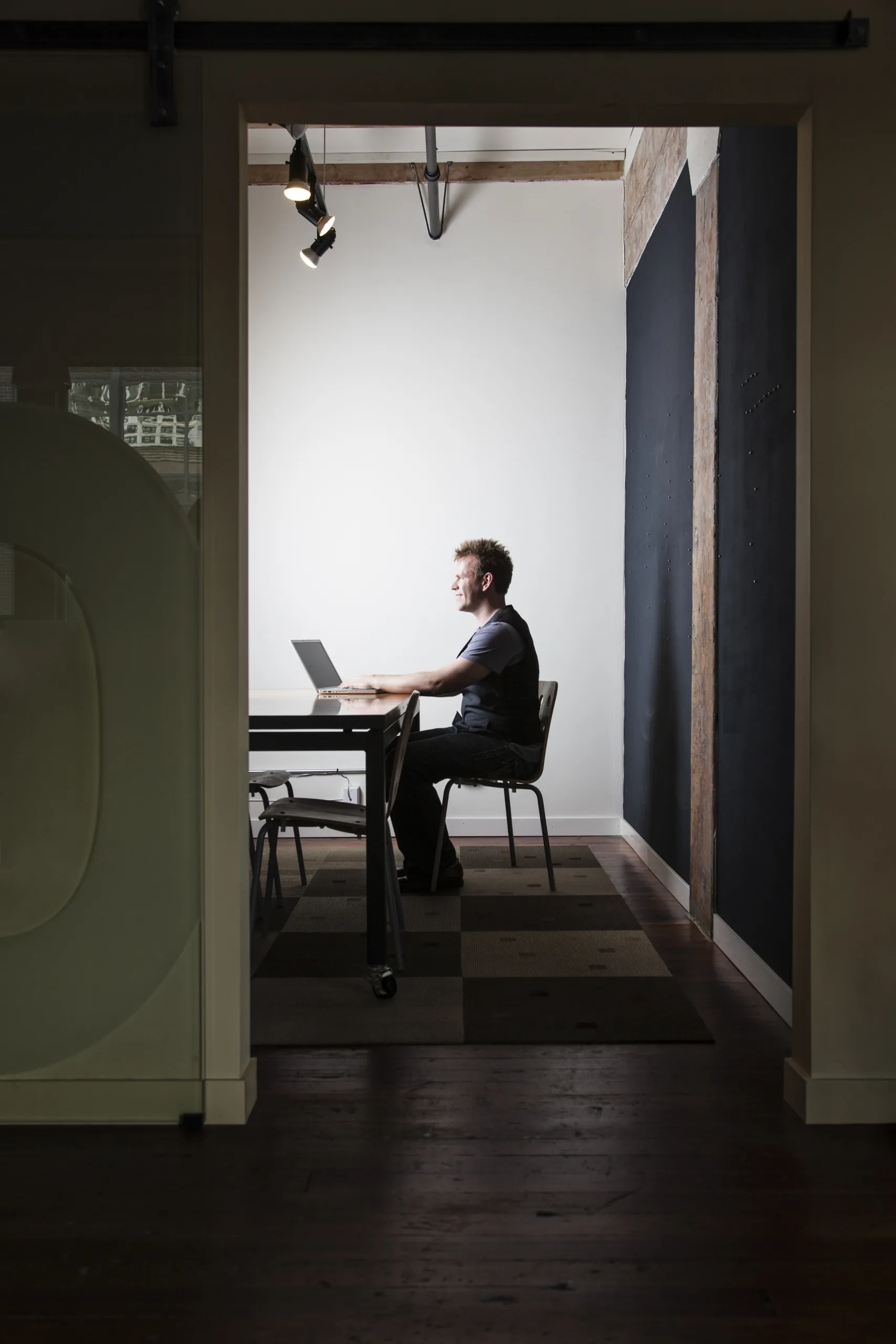 Man working on a laptop in a modern office