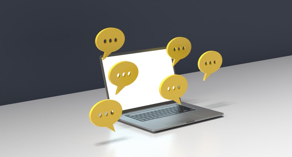 desktop surrounded by message bubbles