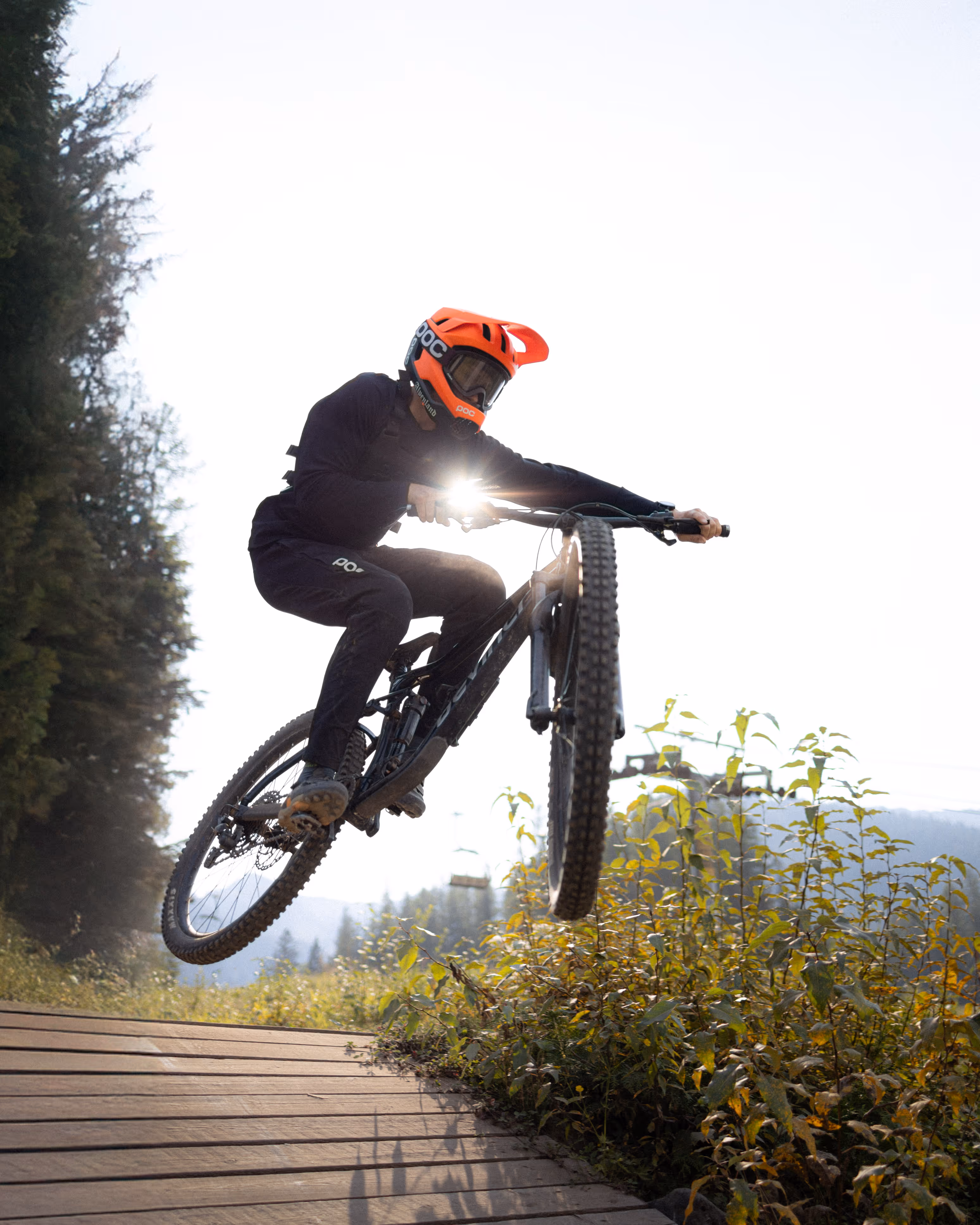 Image of mountain biker in Fernie, BC jumping off a drop.
