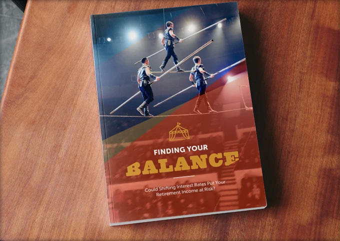 Retirement guide titled 'Finding Your Balance' with image of a tightrope walker balancing on a wire above an audience.