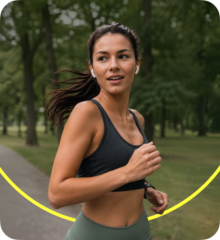 Woman jogging outdoors in a park wearing athletic clothes and wireless earbuds with a yellow arc below.
