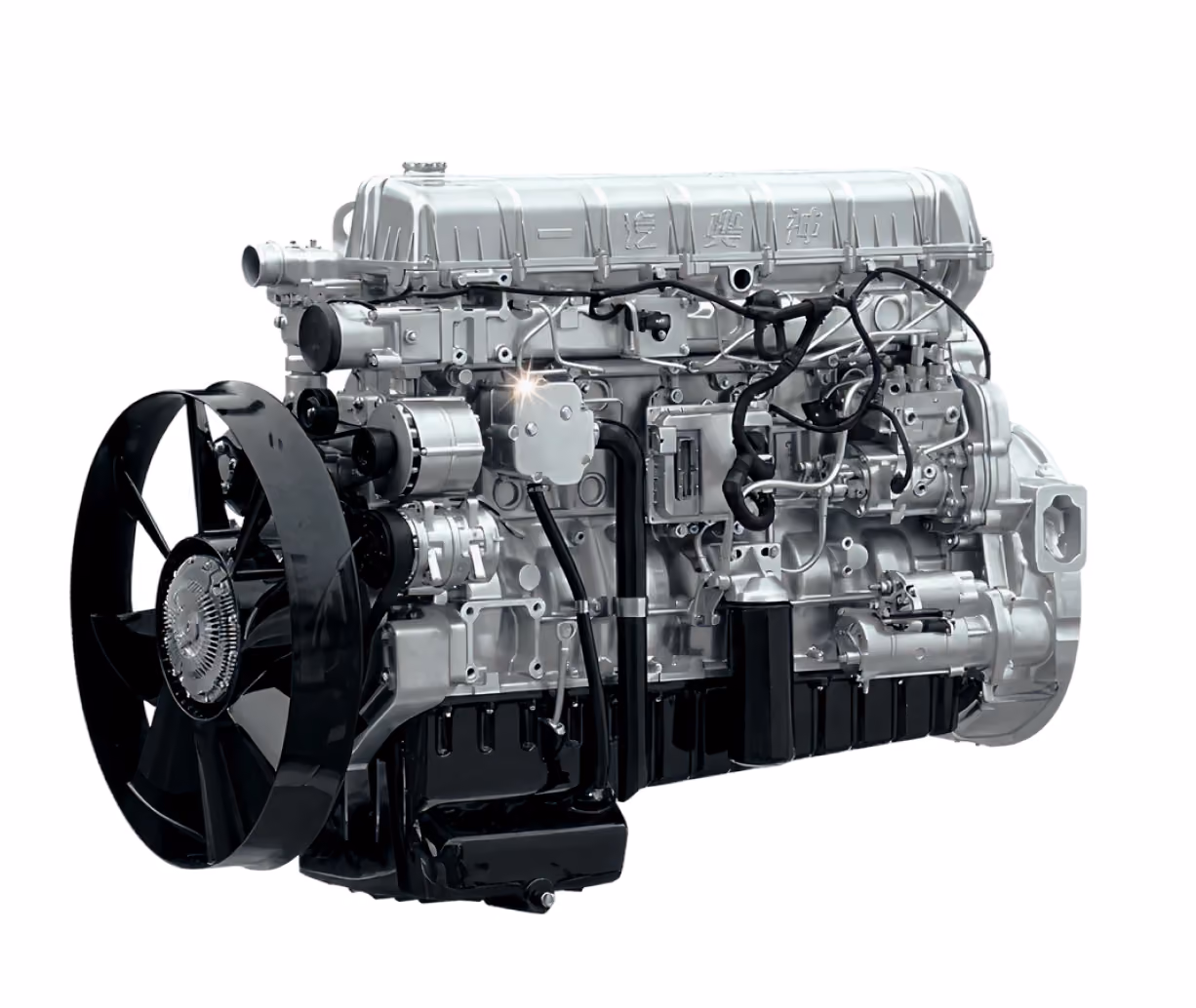 Metallic vehicle engine with black cooling fan and several attached components on a white background.