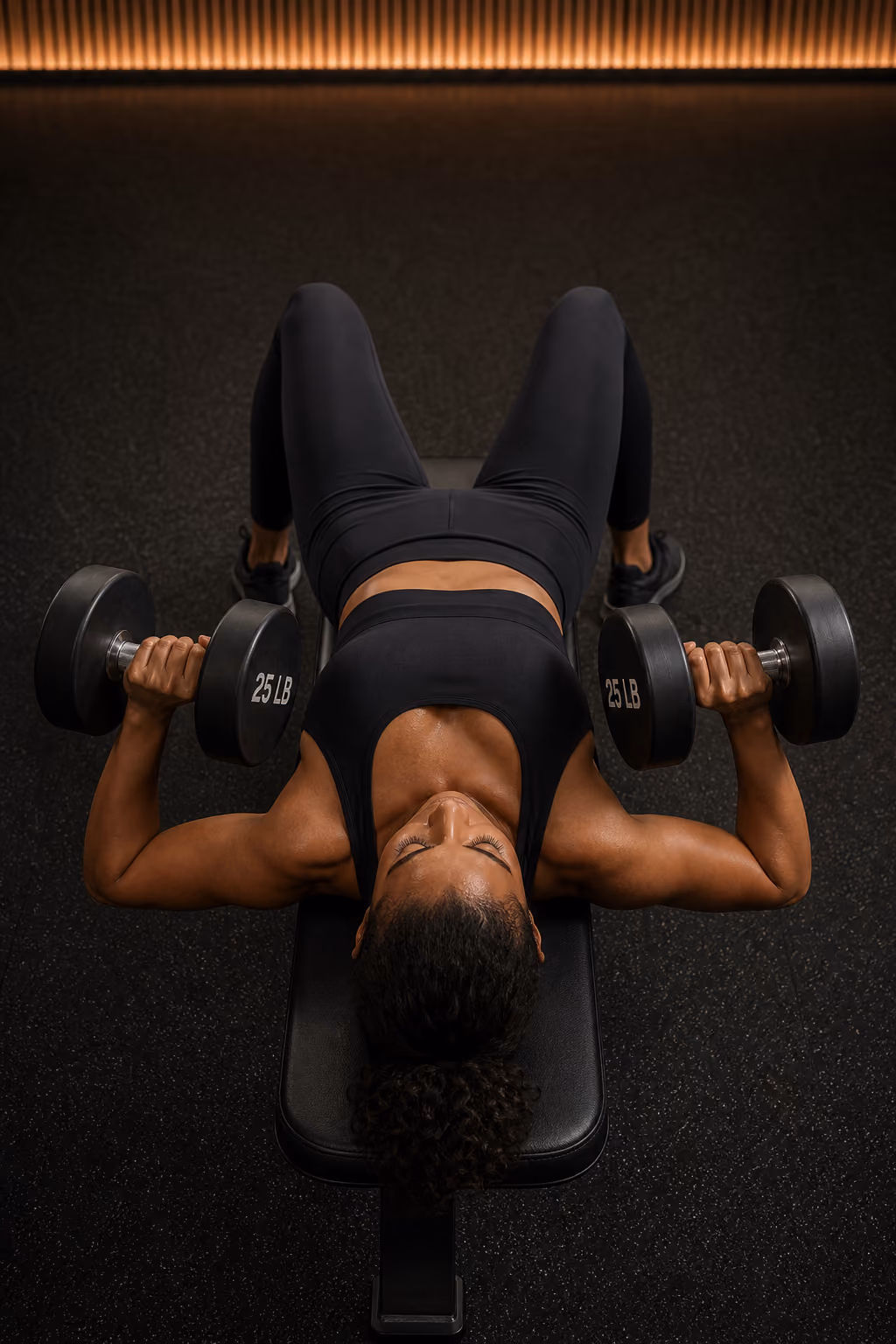 Person performing a dumbbell bench press