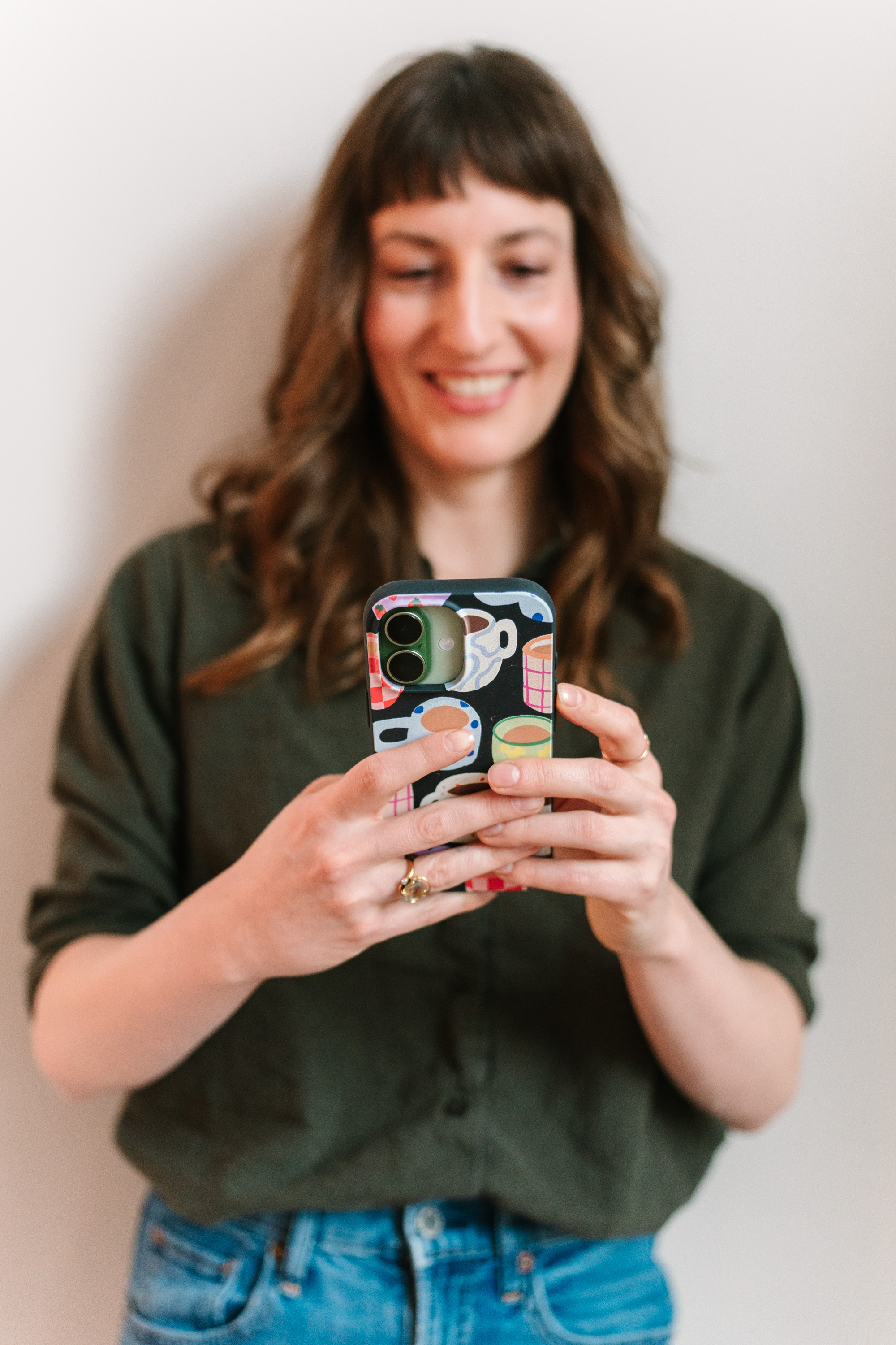 Deanne Vincent smiling at her phone
