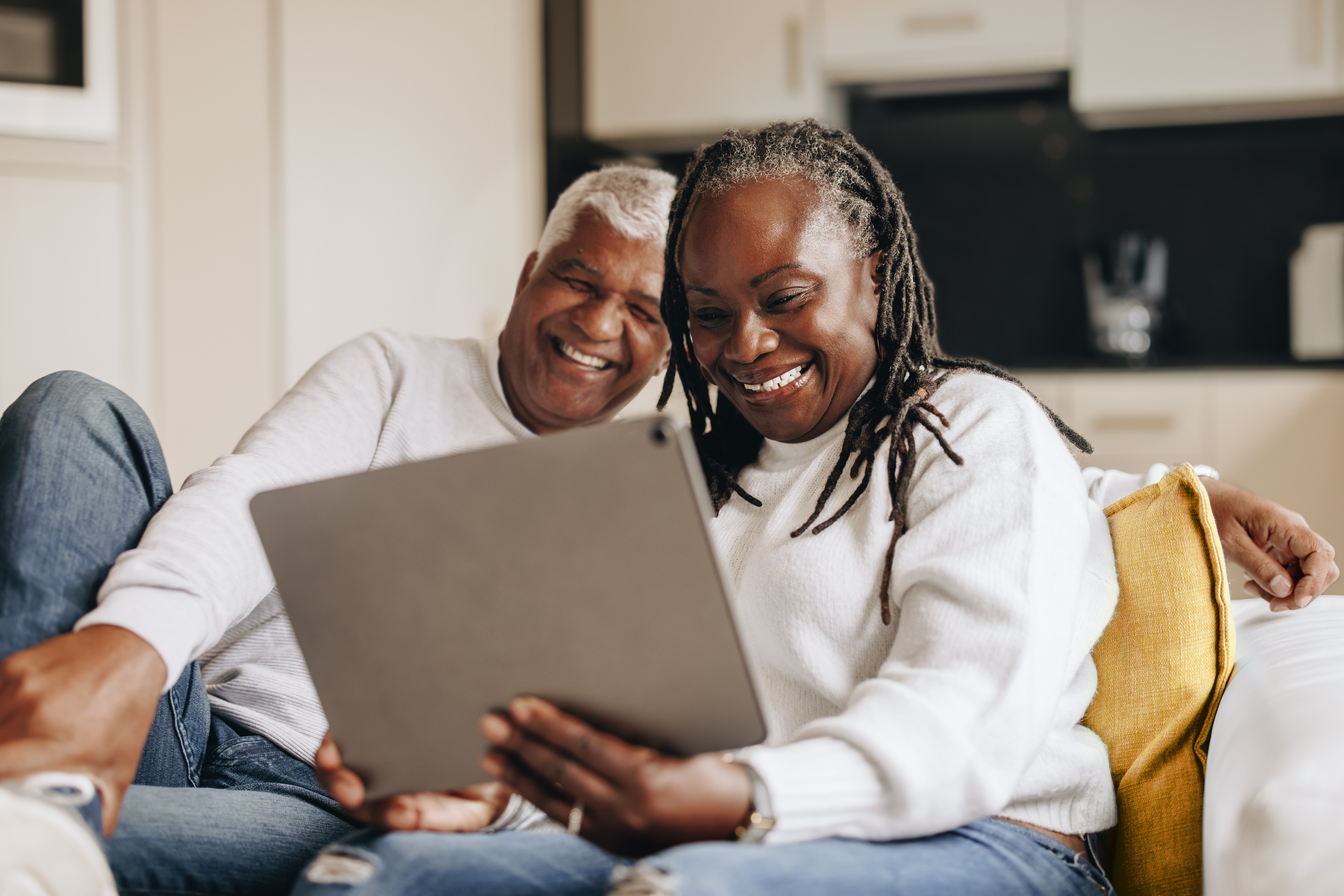 Senior couple using laptop stock photo