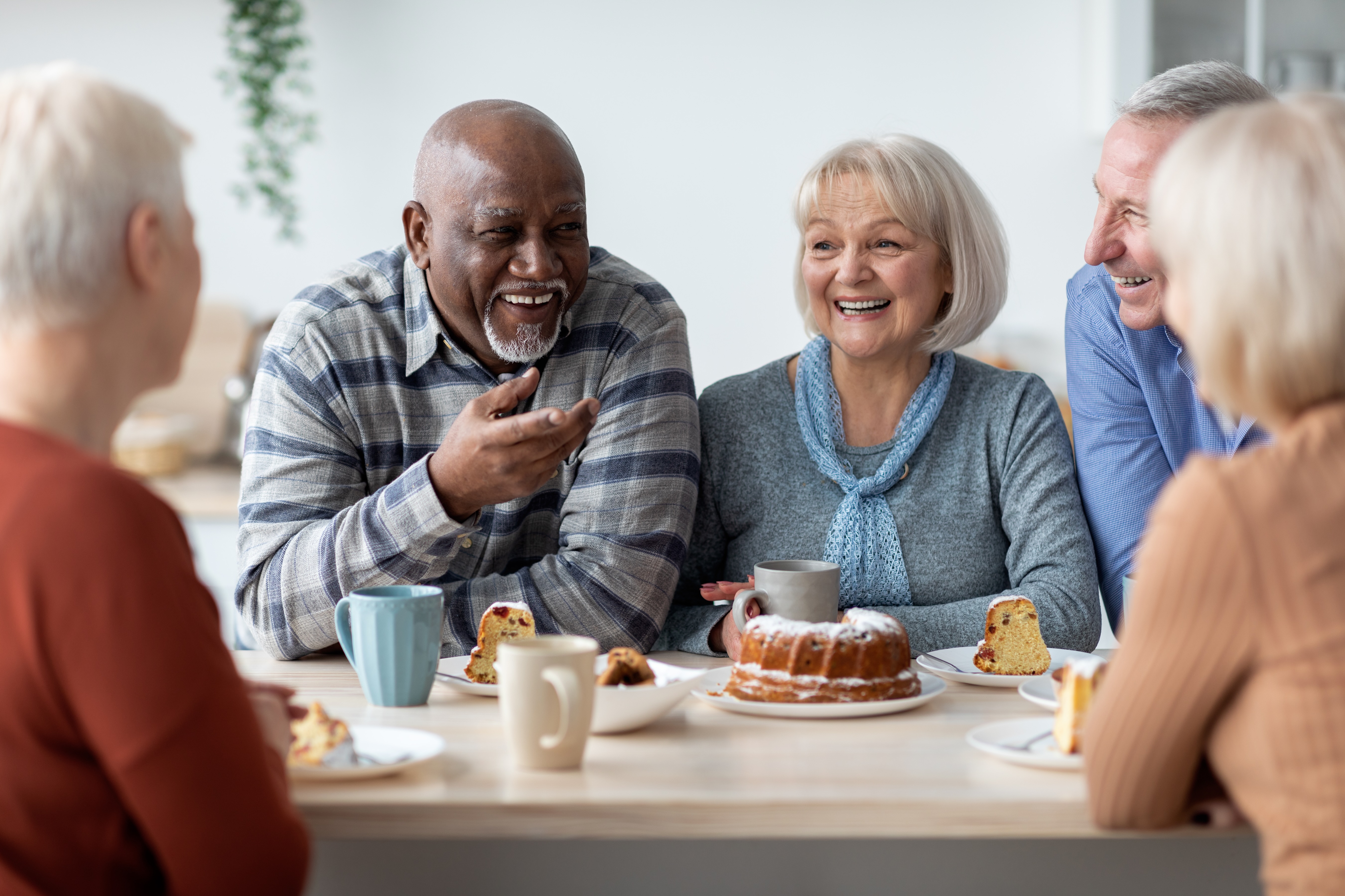 Seniors sitting at the table stock photo