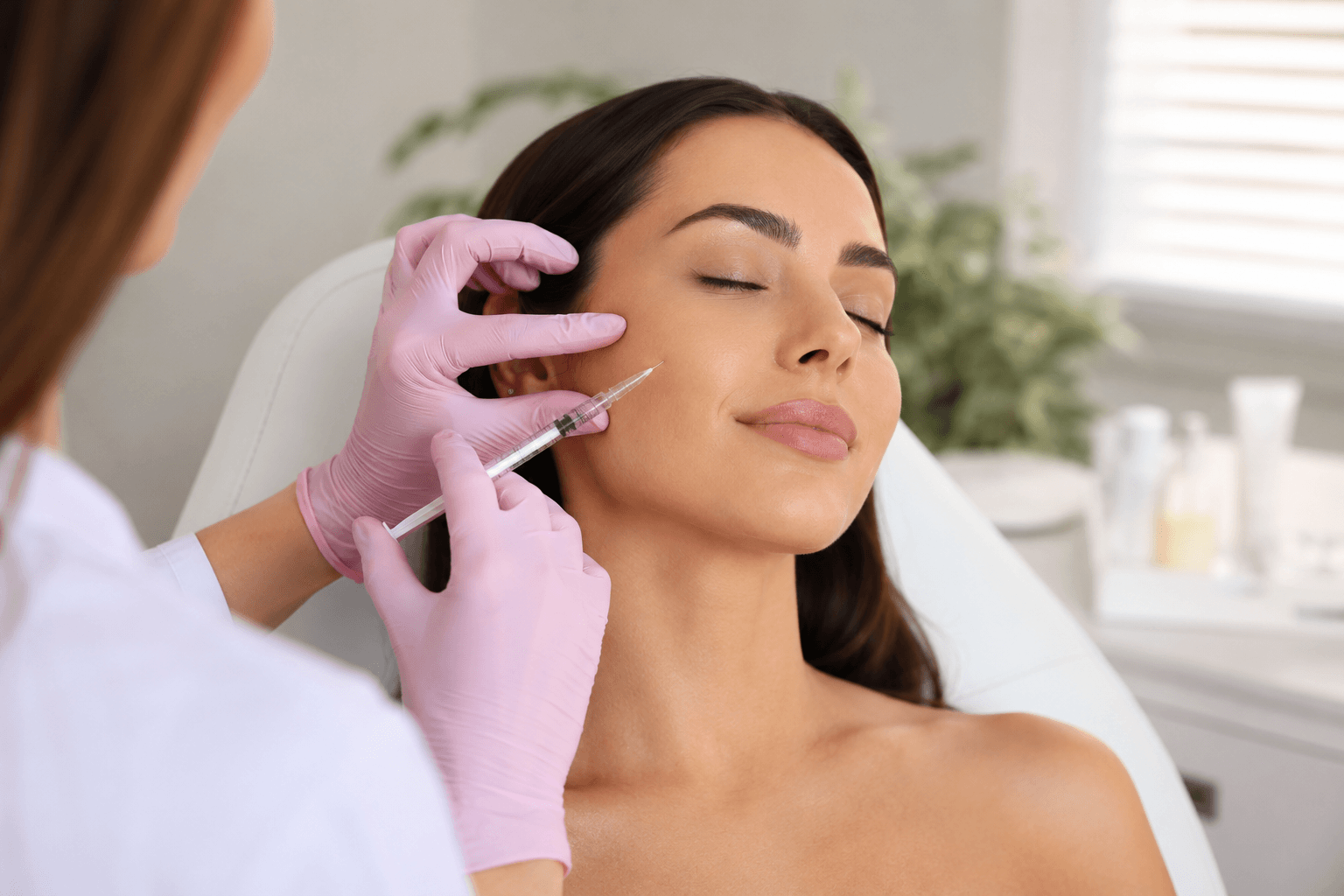 Patient receiving Sculptra injections for facial volume restoration in Santa Clara California medspa