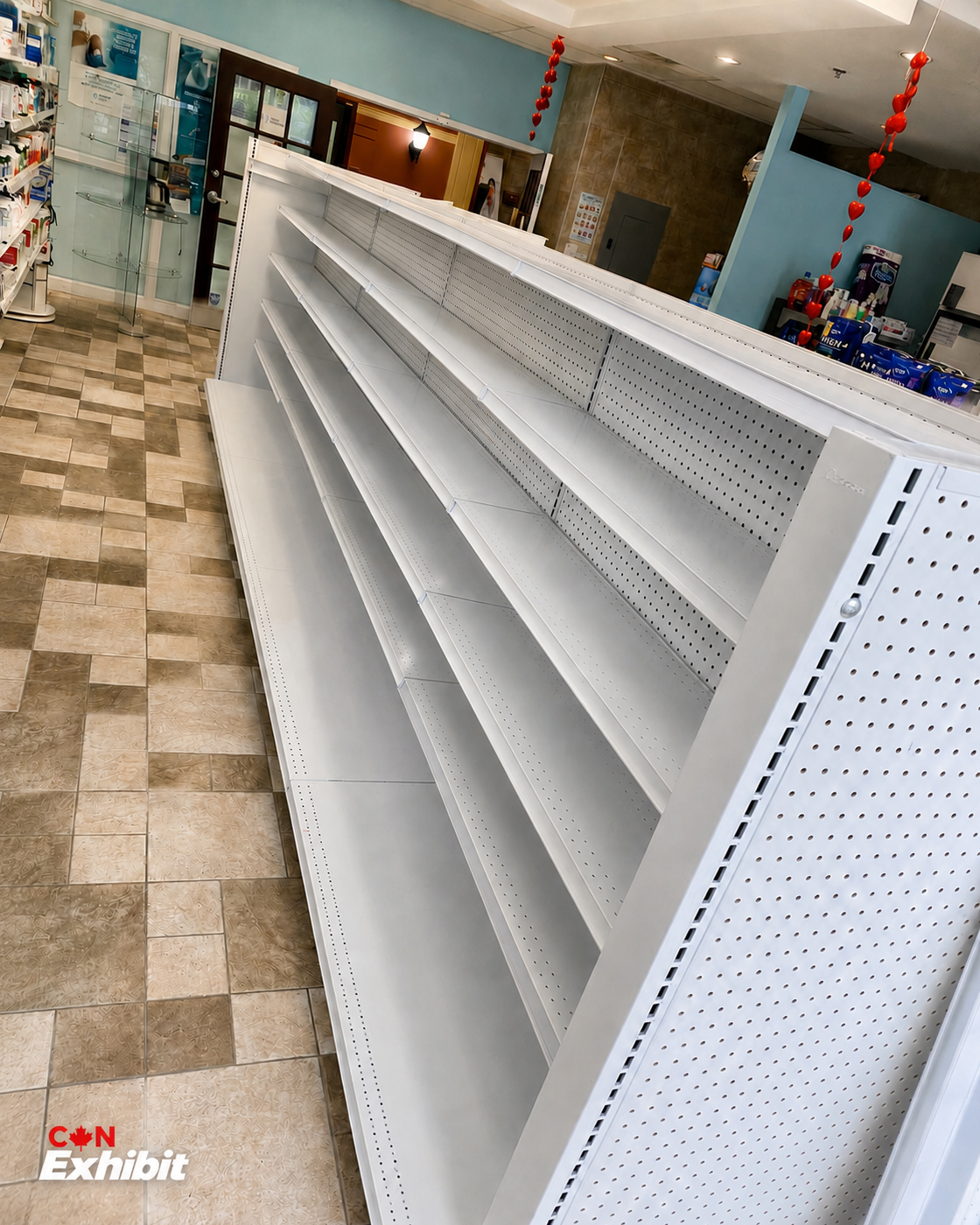 White retail gondola shelving installed in the Montreal project