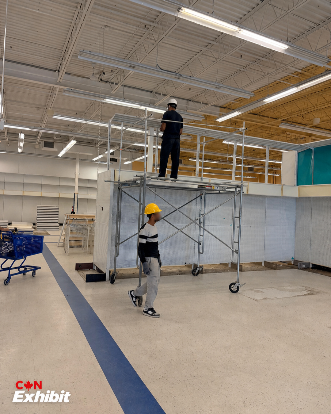 CanExhibit team working beside retail shelving in Kingston