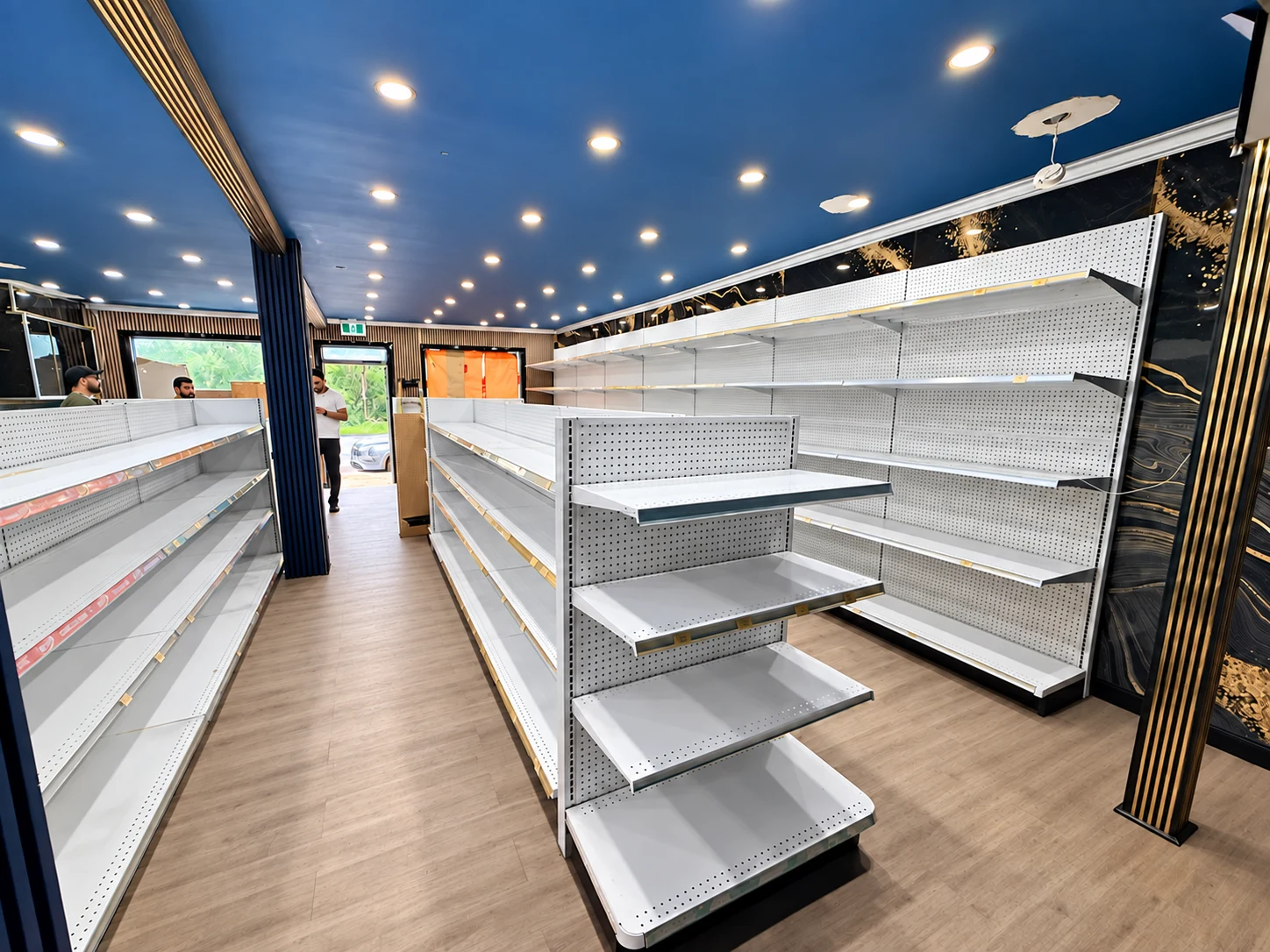 Gondola shelving and wall displays beneath the blue ceiling of the Ottawa retail store