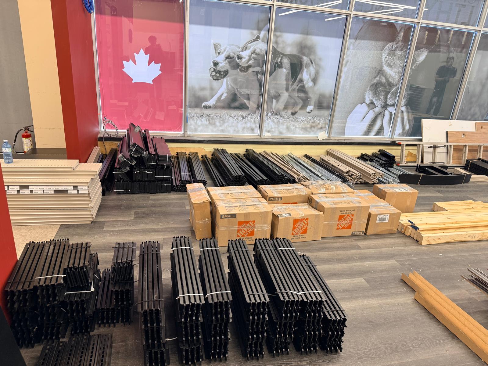 Shelving parts organized into separate stacks for loading.