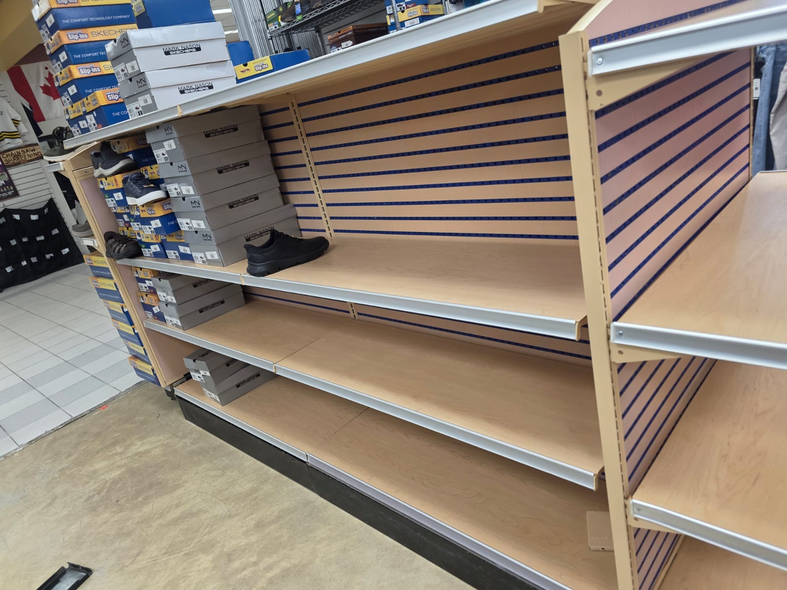 Adjustable shelving and the first merchandise displays.
