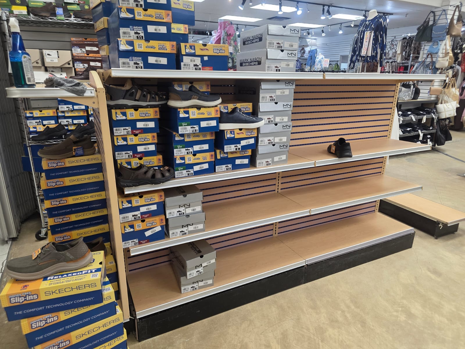 A long gondola run prepared for footwear displays.