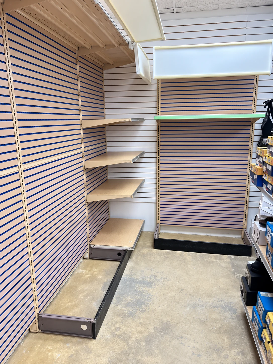 Wall shelving and an end display at the corner.