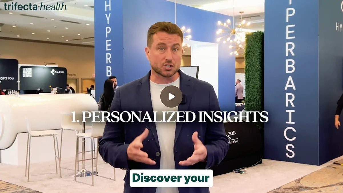 Man in navy blazer presenting at a health-related event with 'PERSONALIZED INSIGHTS' text overlay.