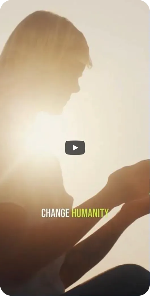 Silhouette of person holding a small animal or object with sunlight behind and text 'CHANGE HUMANITY'.