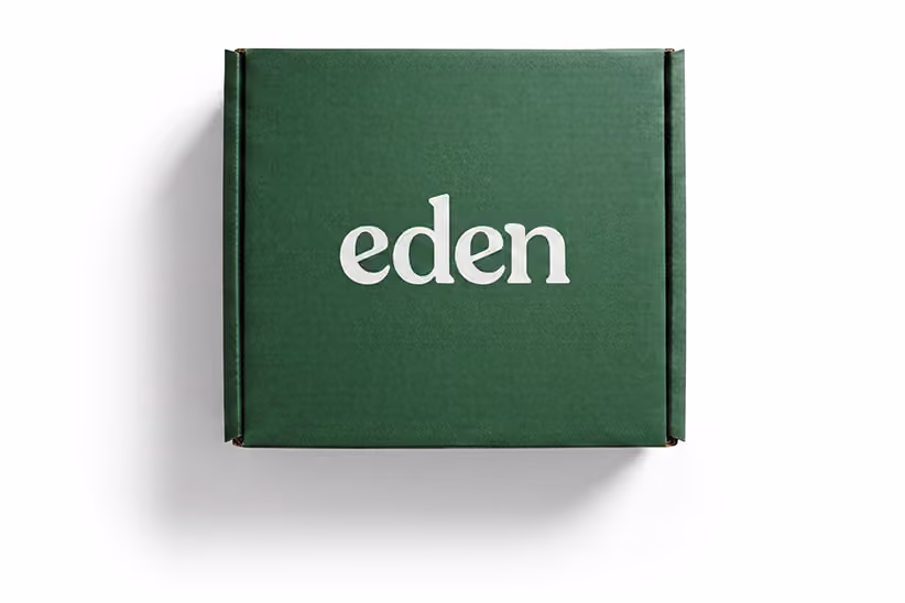 Green shipping box with Eden logo printed in white on the top surface.