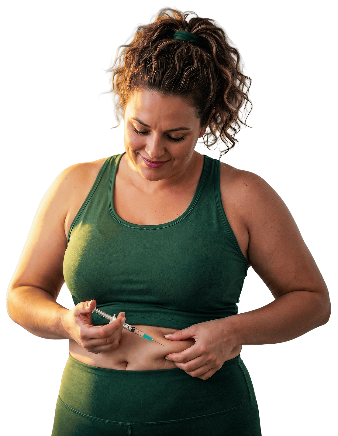 Woman in green workout clothes injecting herself in the abdomen with a syringe.