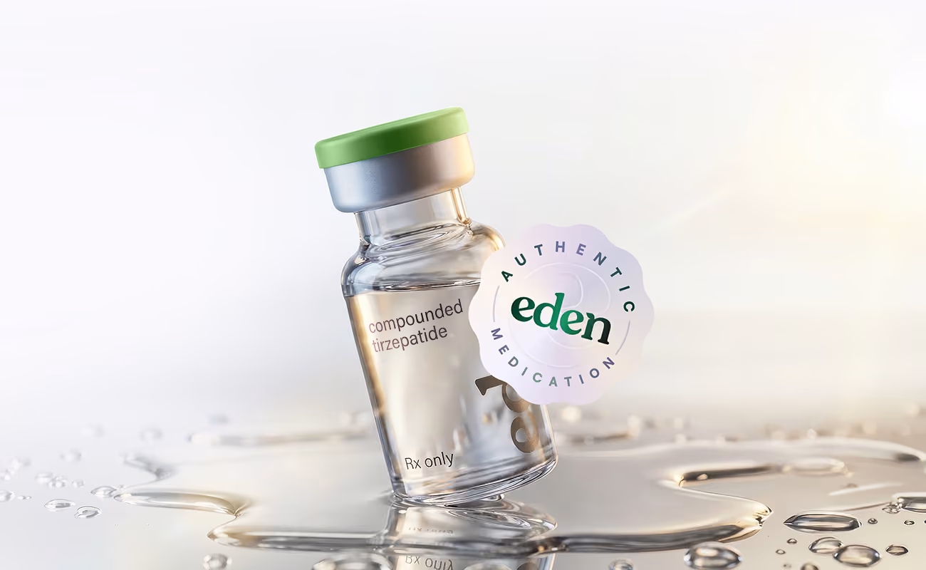 Glass vial labeled compounded tirzepatide with Eden authentic medication seal on sunlit reflective surface.