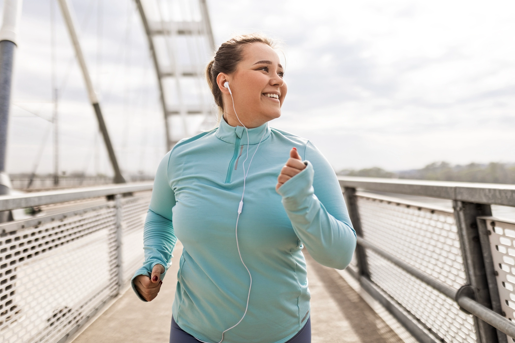 Woman jogging outdoors for an article comparing Foundayo and the Wegovy pill as oral GLP-1 weight loss options.