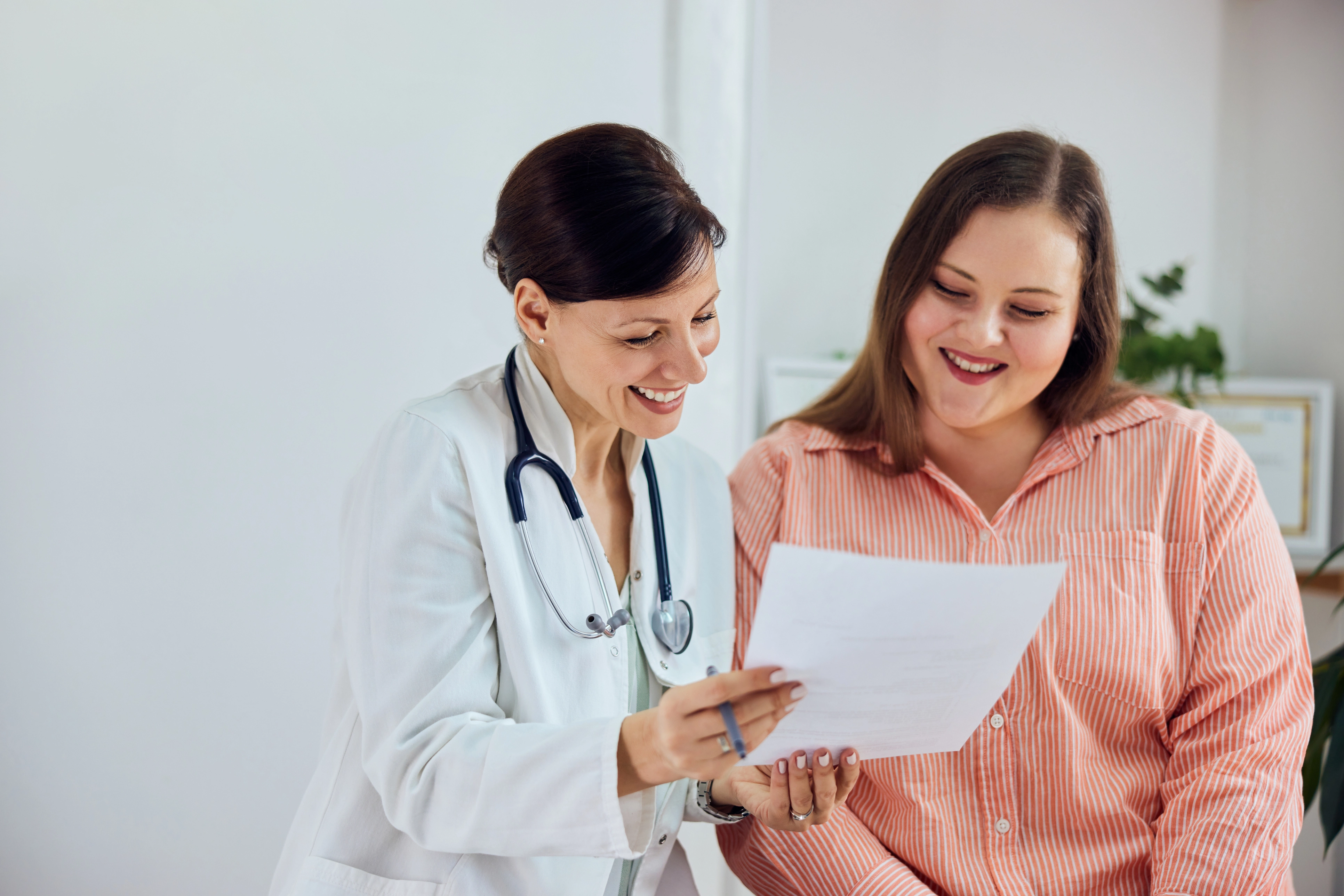 Healthcare provider reviewing lab results for an article about normal IGF-1 levels and how results are interpreted.
