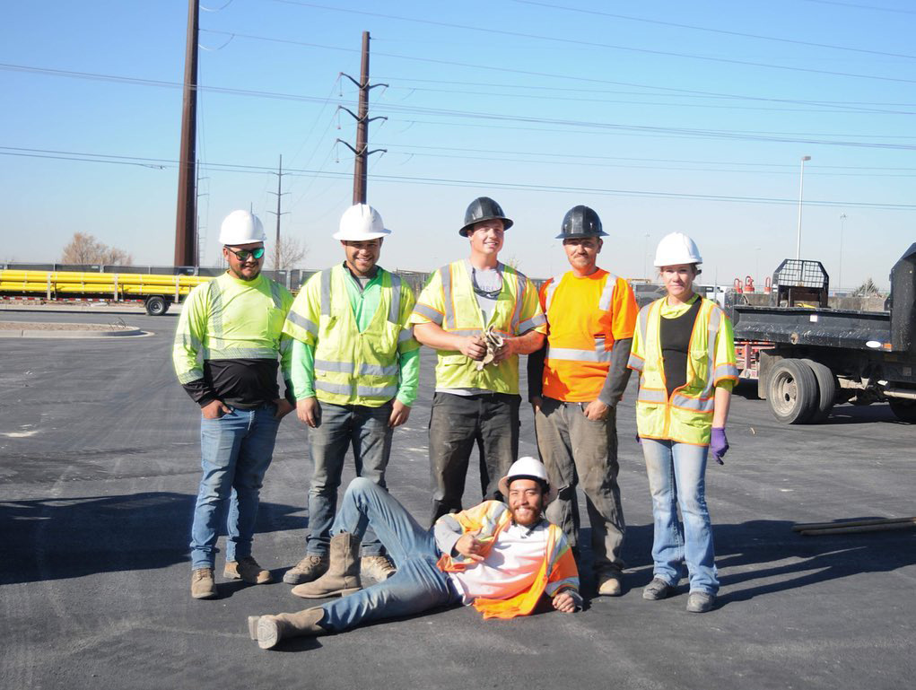 Construction crew posing for photo.