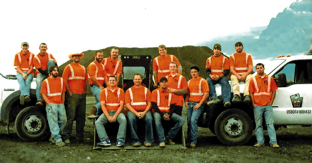 Construction crew posing for photo.