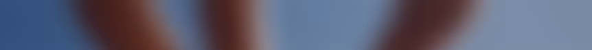 Blurred image with blue and brown tones, unclear content.
