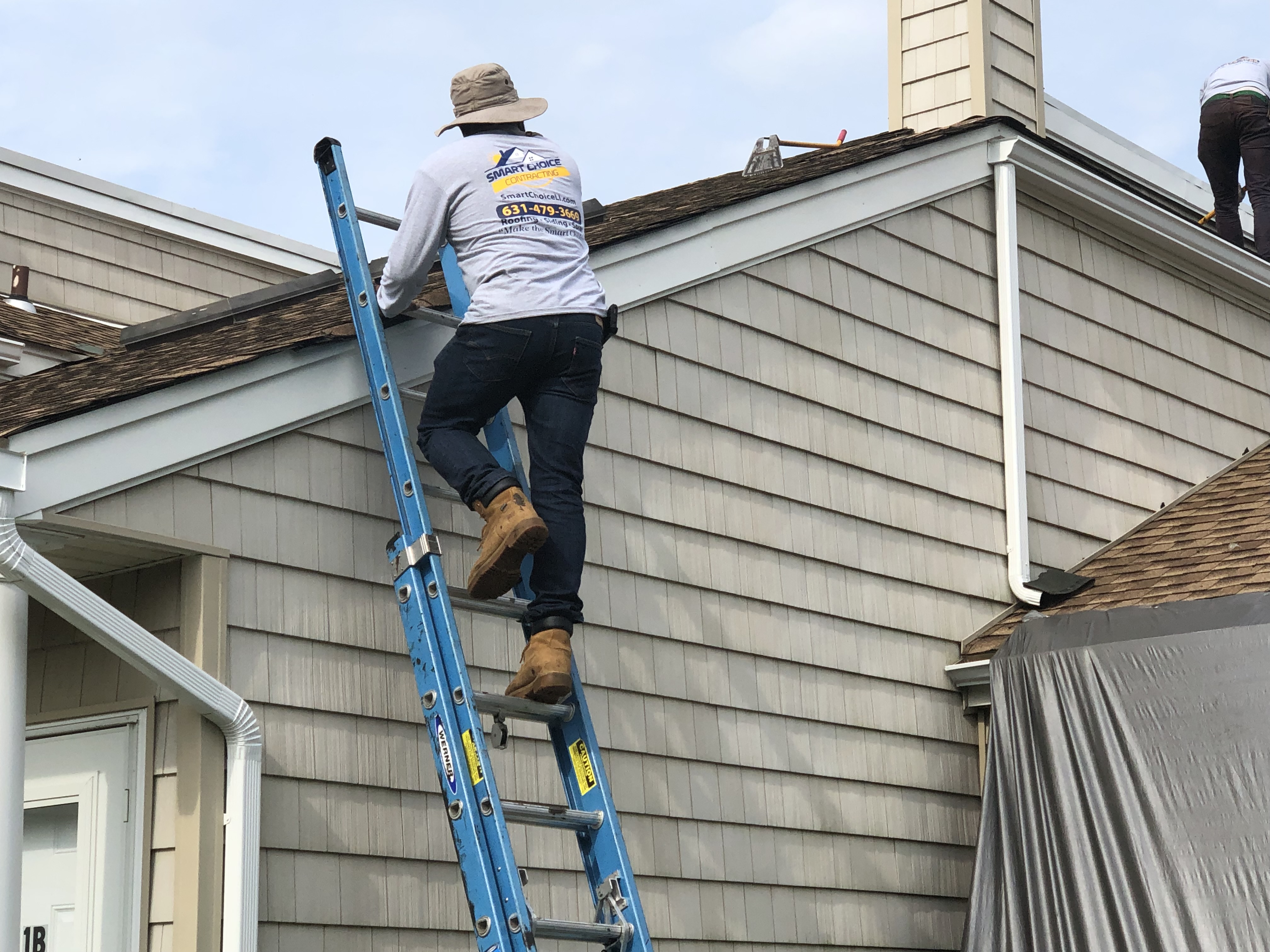 Smart Choice Contracting crew replacing a residential roof in Melville, Long Island, NY