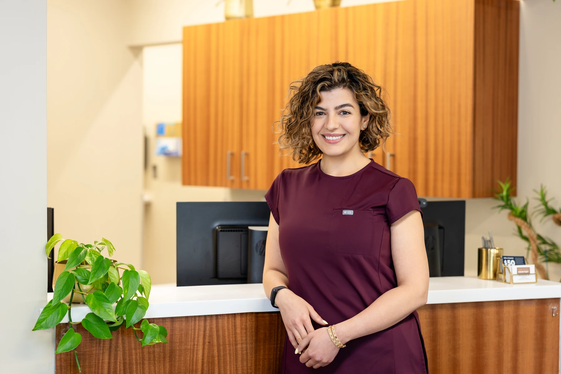 Team member welcoming patients at the front desk of Seattle's Downtown Dentist on Westlake Ave