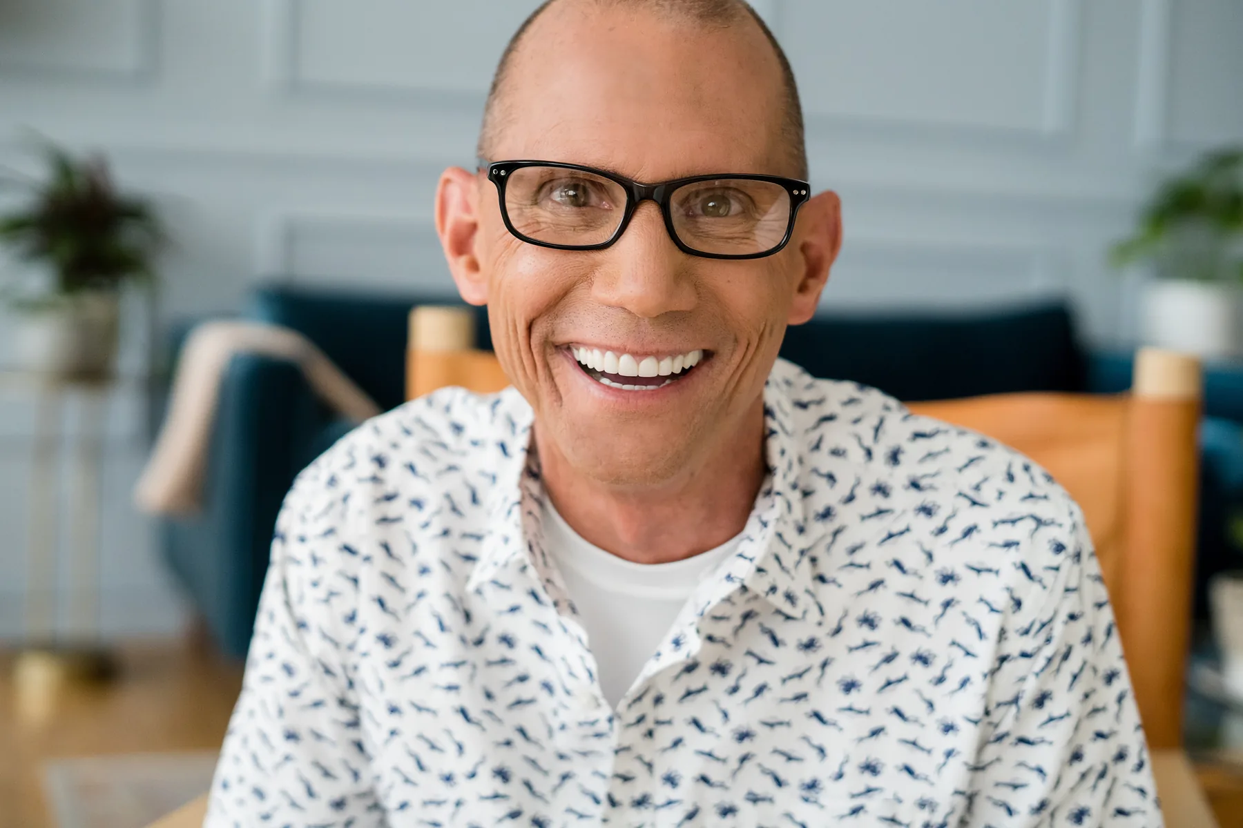 Man with glasses smiling