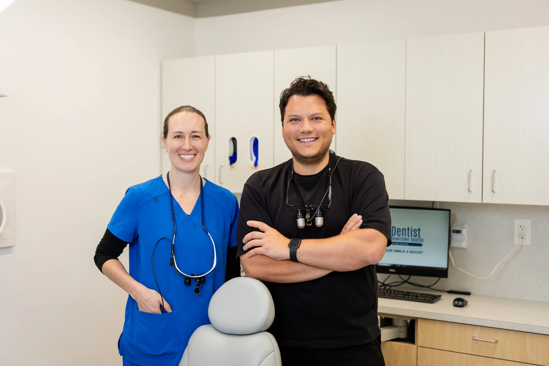 Dentist and hygienist at Dentist Downtown Seattle, where implants are placed and restored in-house