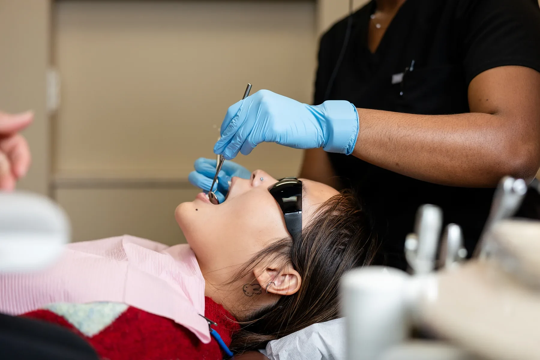 Hygienist performing a professional cleaning on a patient