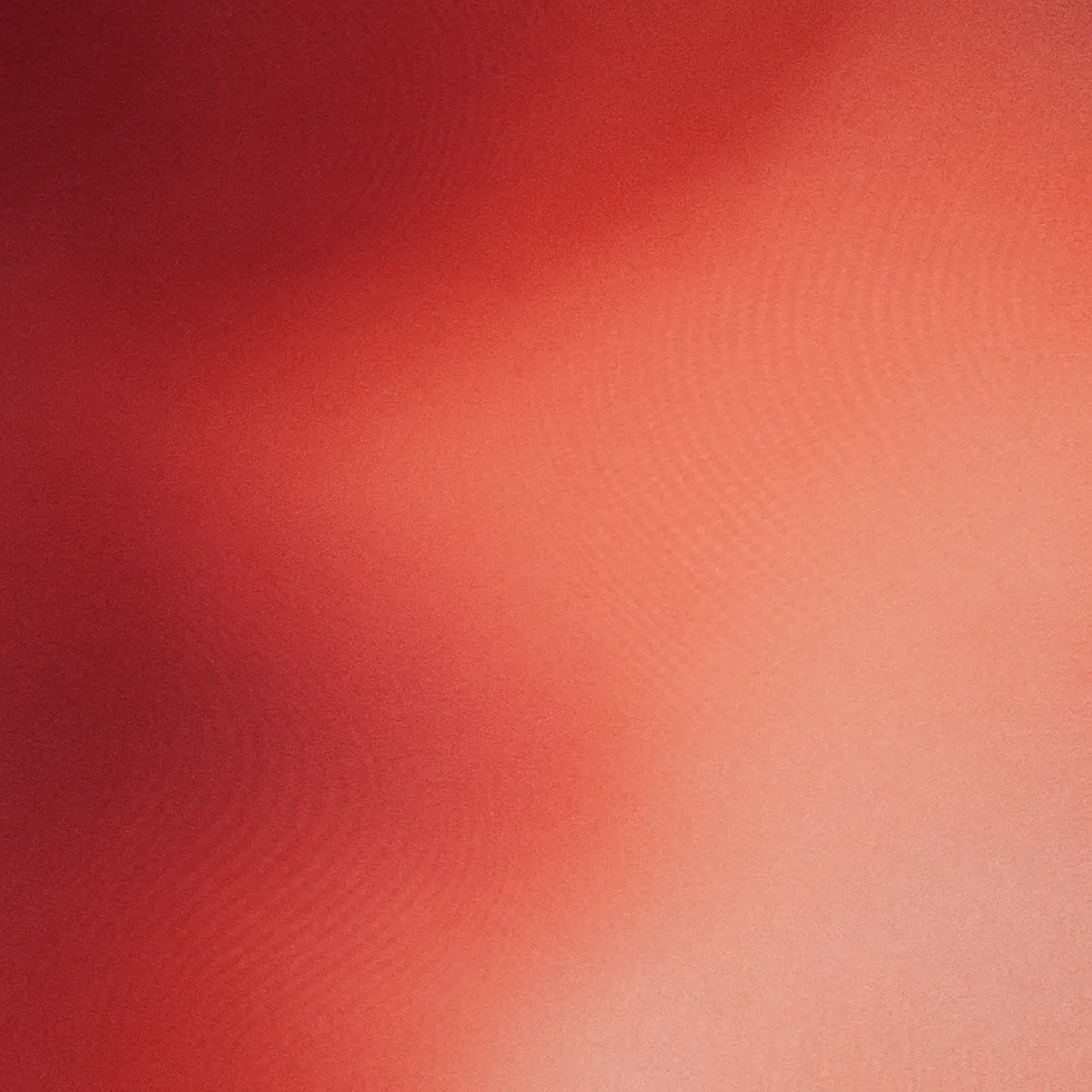 Warm gradient texture blending deep red into lighter coral and peach tones.
