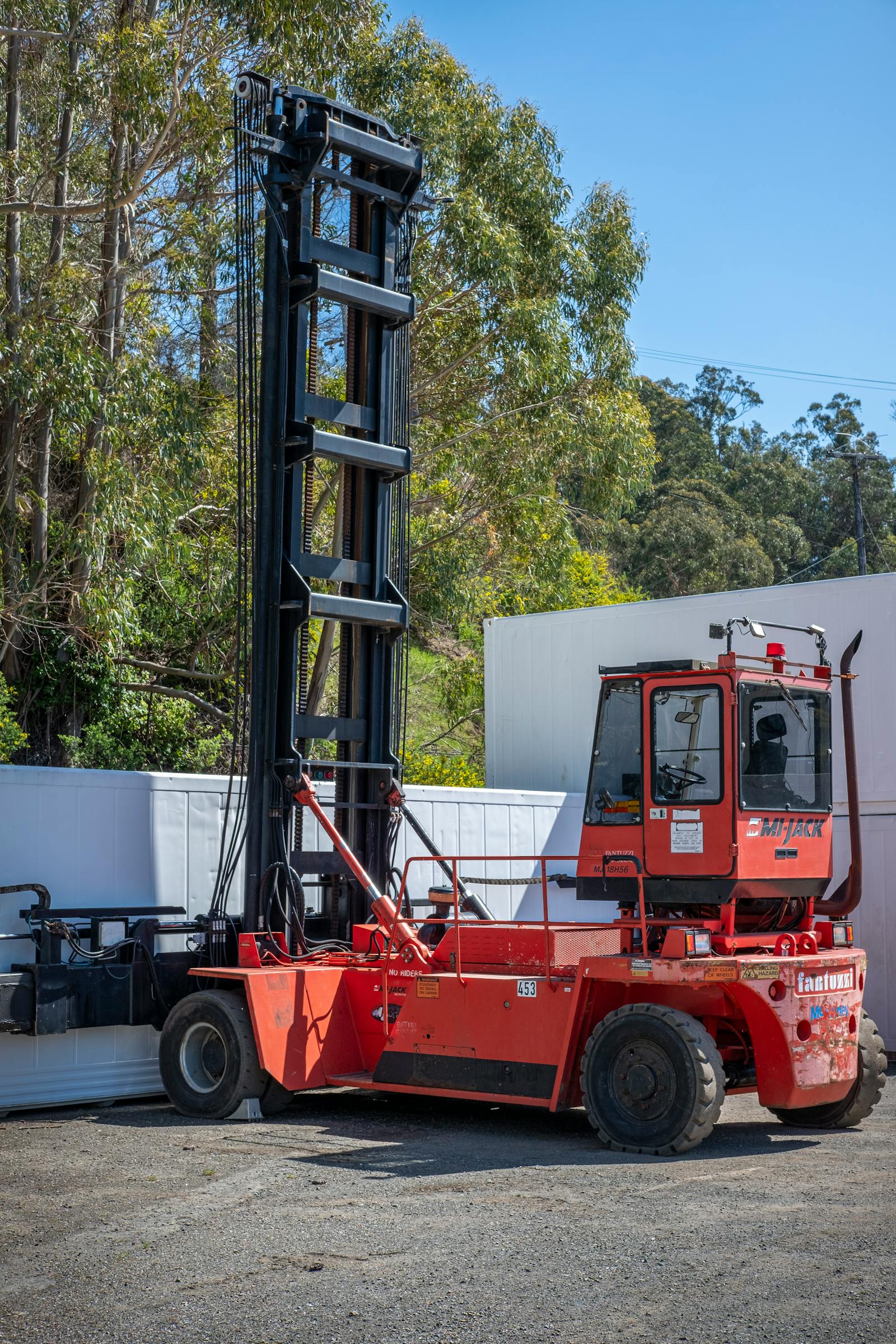 Forklift loader by a warehouse