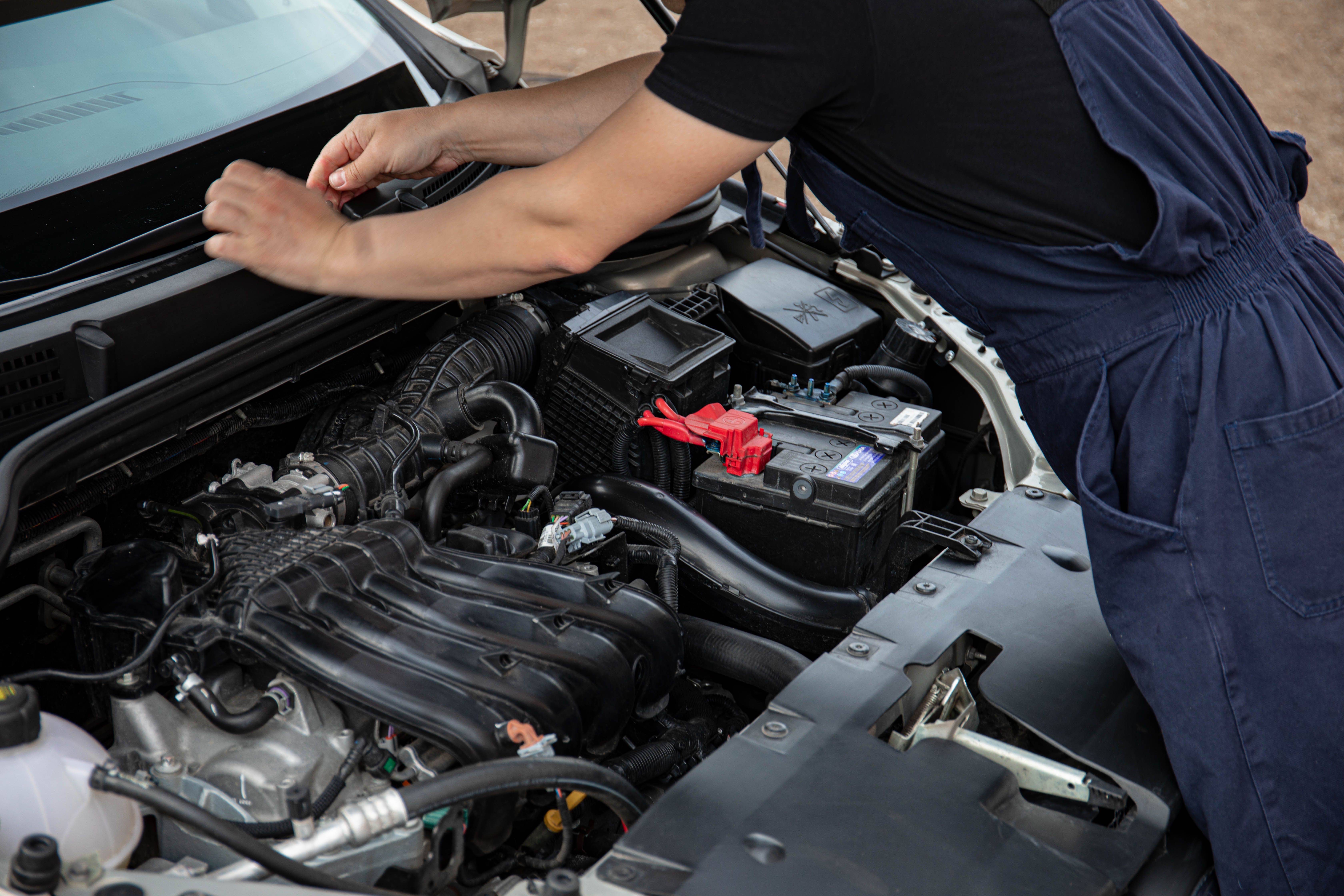 Mechanic working on a car in an auto repair shop