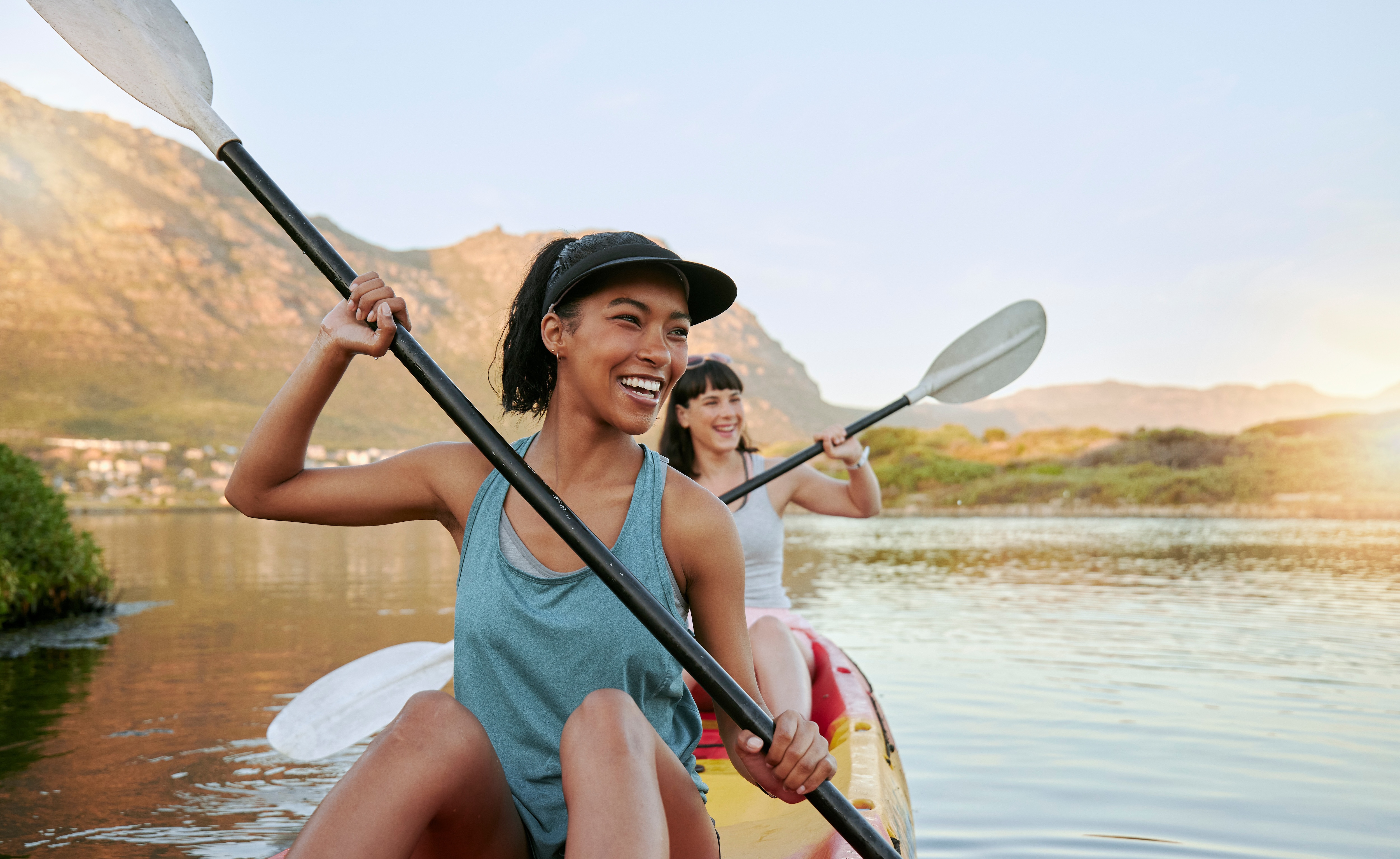 Friends kayaking in lake stock image 