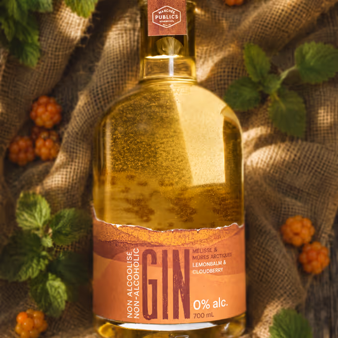 Non-alcoholic gin bottle labeled lemon balm and cloudberry on burlap with leaves and berries. (Adobe Firefly)