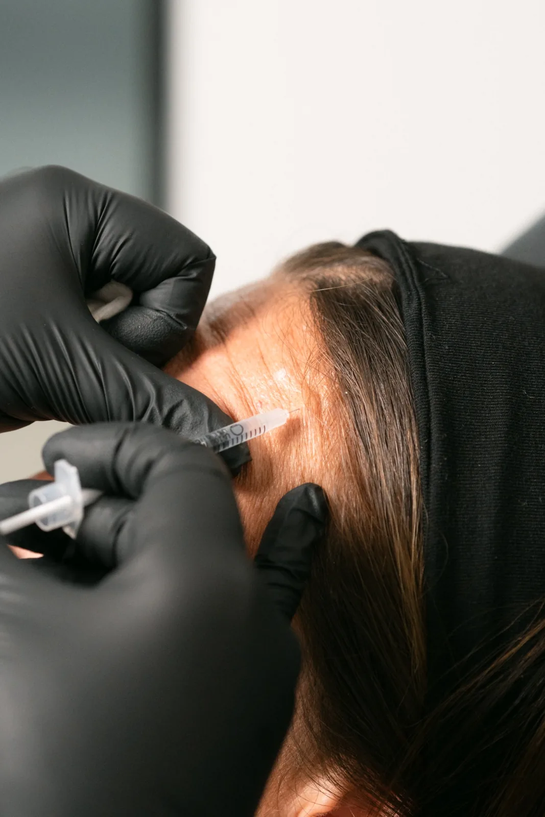 Provider performing neurotoxin treatment at BevelUp in Tampa