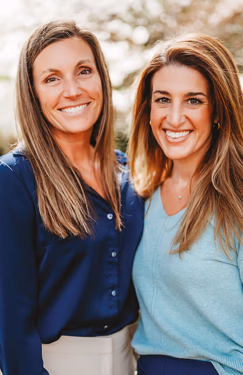Two women smiling together