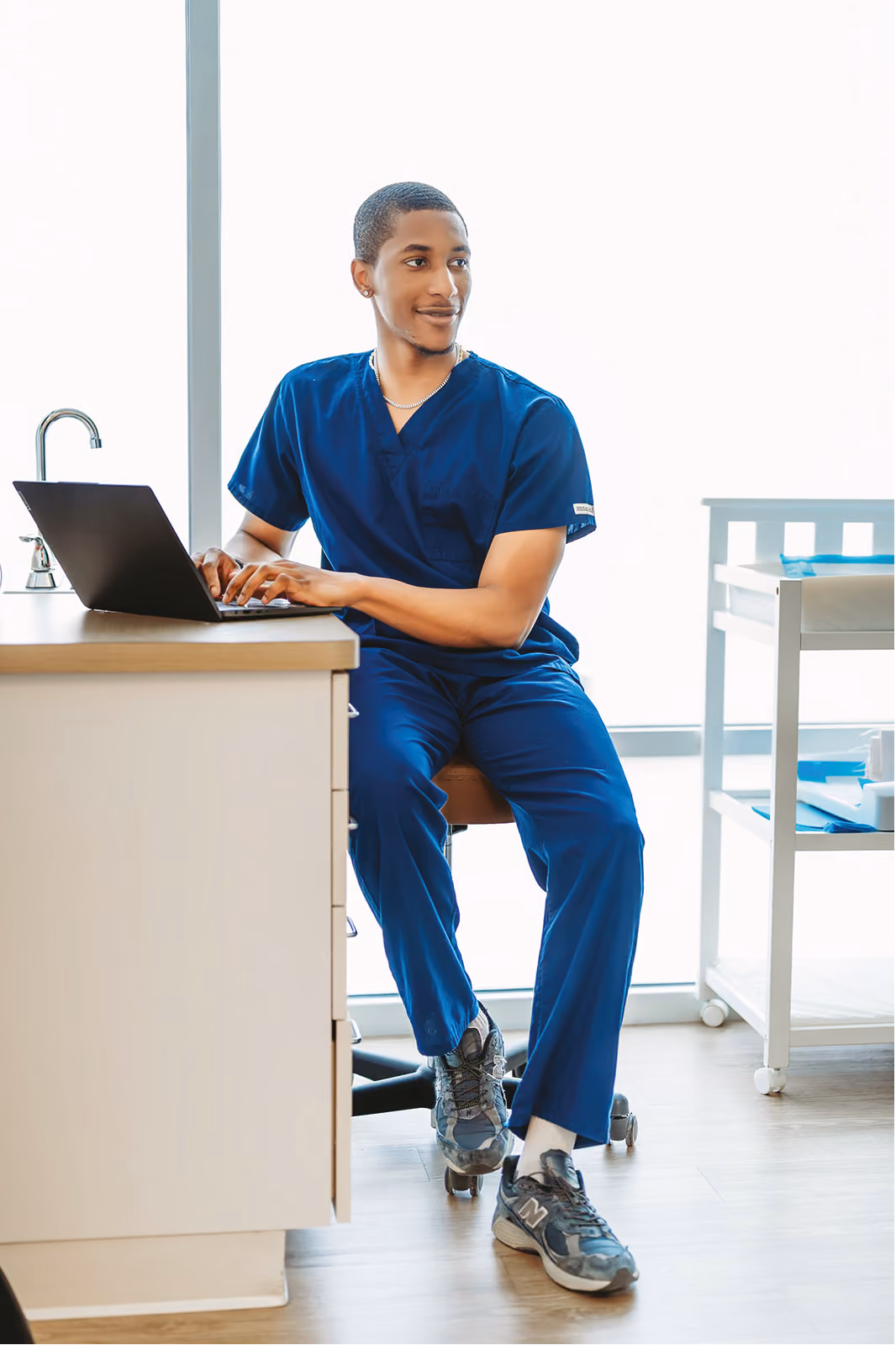 Doctor at laptop in medical office