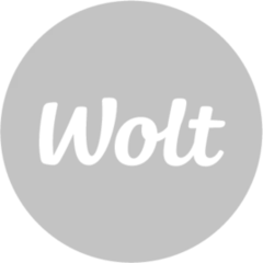Wolt company logo in white text on a black circular background.