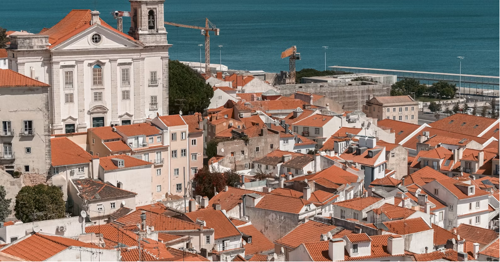 Image source: https://unsplash.com/photos/rooftops-of-a-european-city-with-a-wide-river-9qY3j-OTH7A
