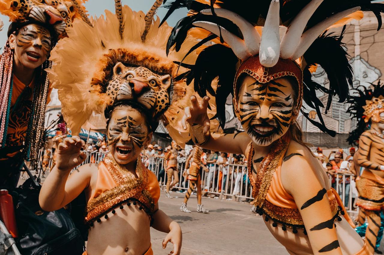 Performer in a colourful Diablo Cojuelo mask and costume at Dominican Carnival in La Vega in February
