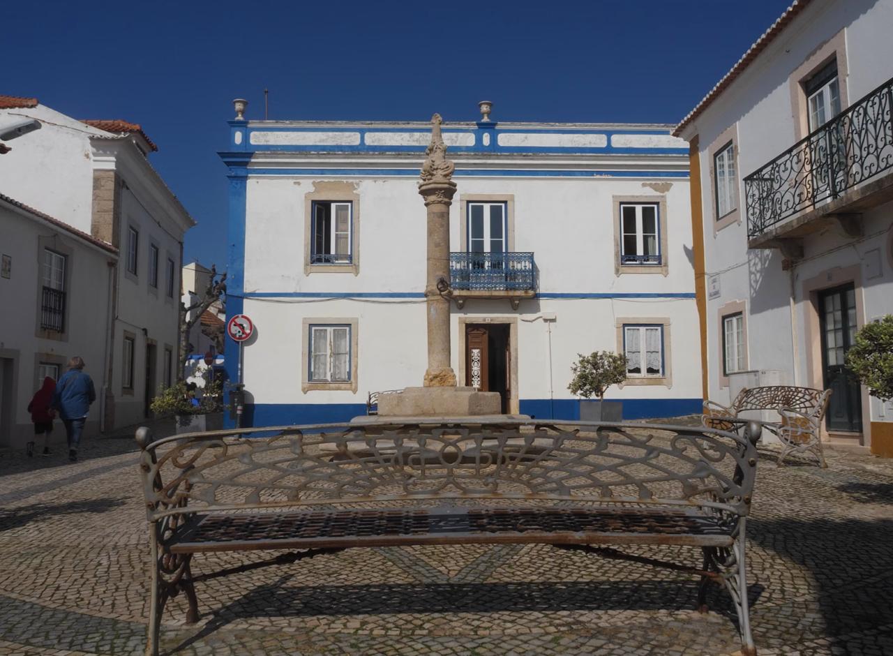 Portugal showcasing classic architecture and a central monument.