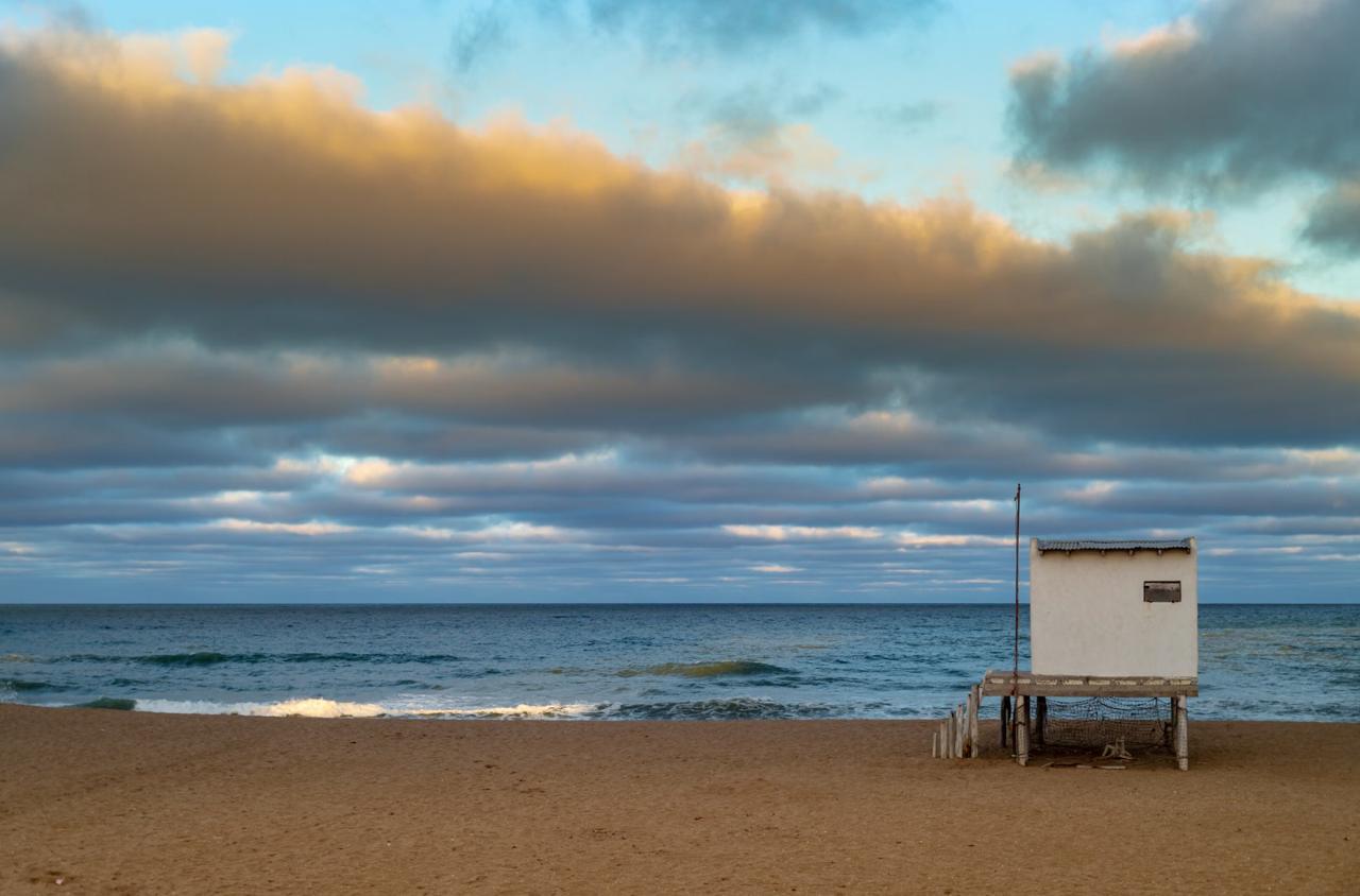 Wooden lifeguard watchtower at Mar Bella beach Barcelona sunset
